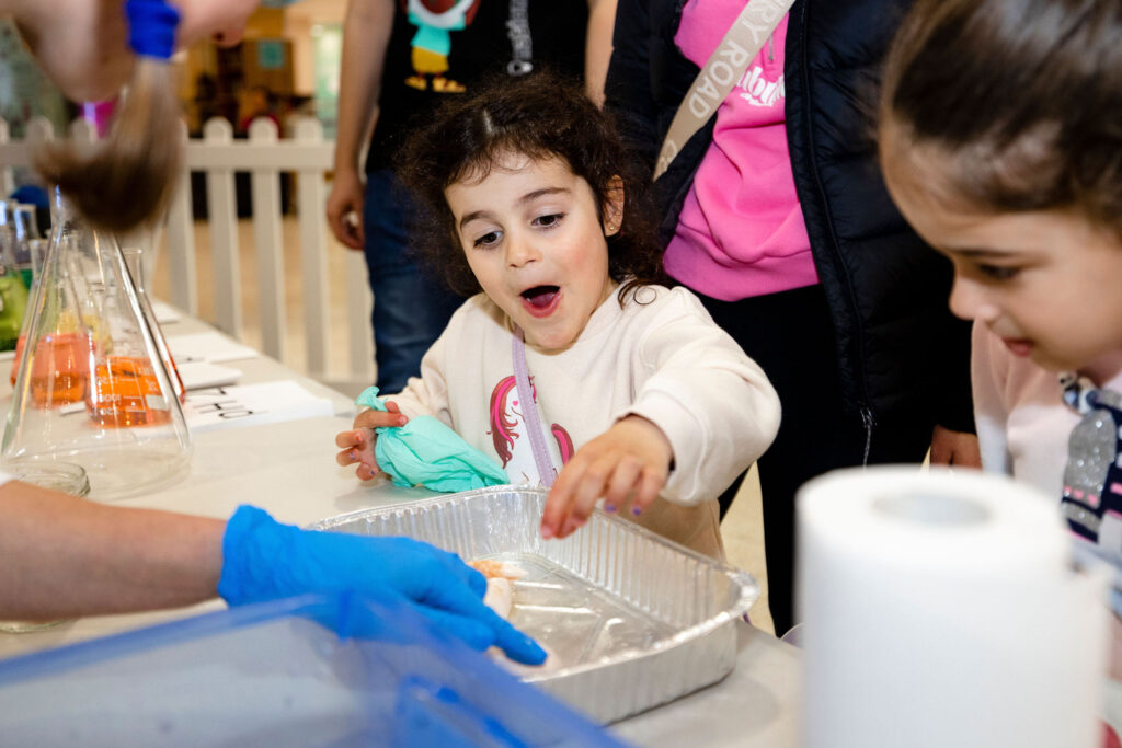 Young girl excited by a science demonstration